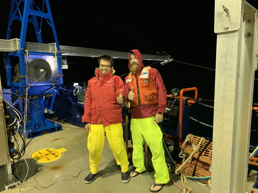 Emerson Hasbrouck and San Nguyen thumbs-up during night ops, MISO-BoB