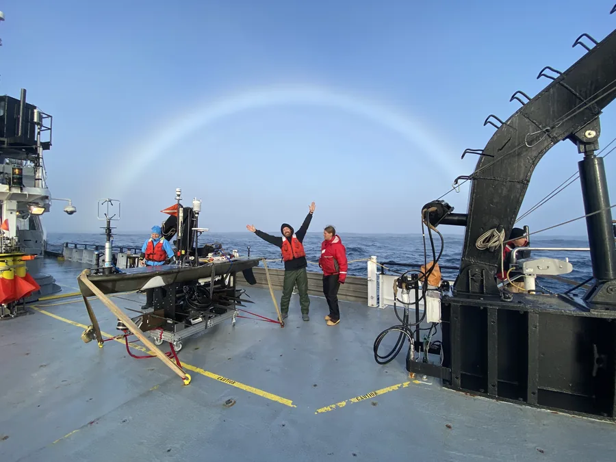 Researchers on R/V Oceanus beneath a fogbow, S-MODE 2021