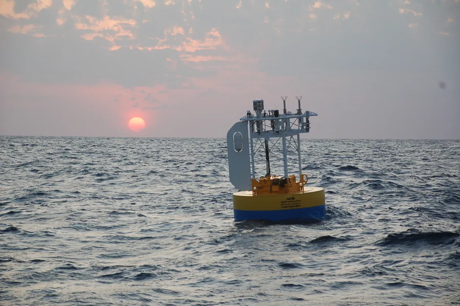KAUST buoy silhouetted against Red Sea sunset